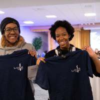 Two students posing with their new I am GV shirts.